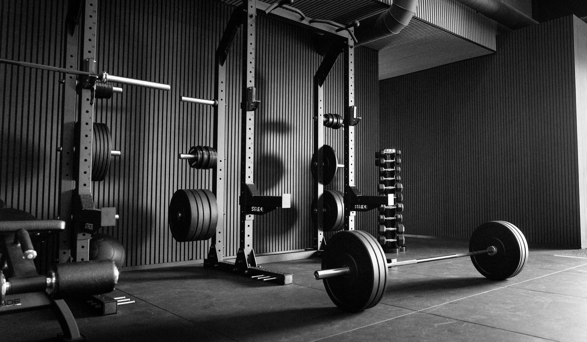 A power rack with a loaded barbell